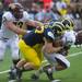 Central Michigan quarterback Alex Niznak is tackled by defensive end Brennen Beyer during the third quarter of their game, Saturday, Aug, 31.
Courtney Sacco I AnnArbor.com  